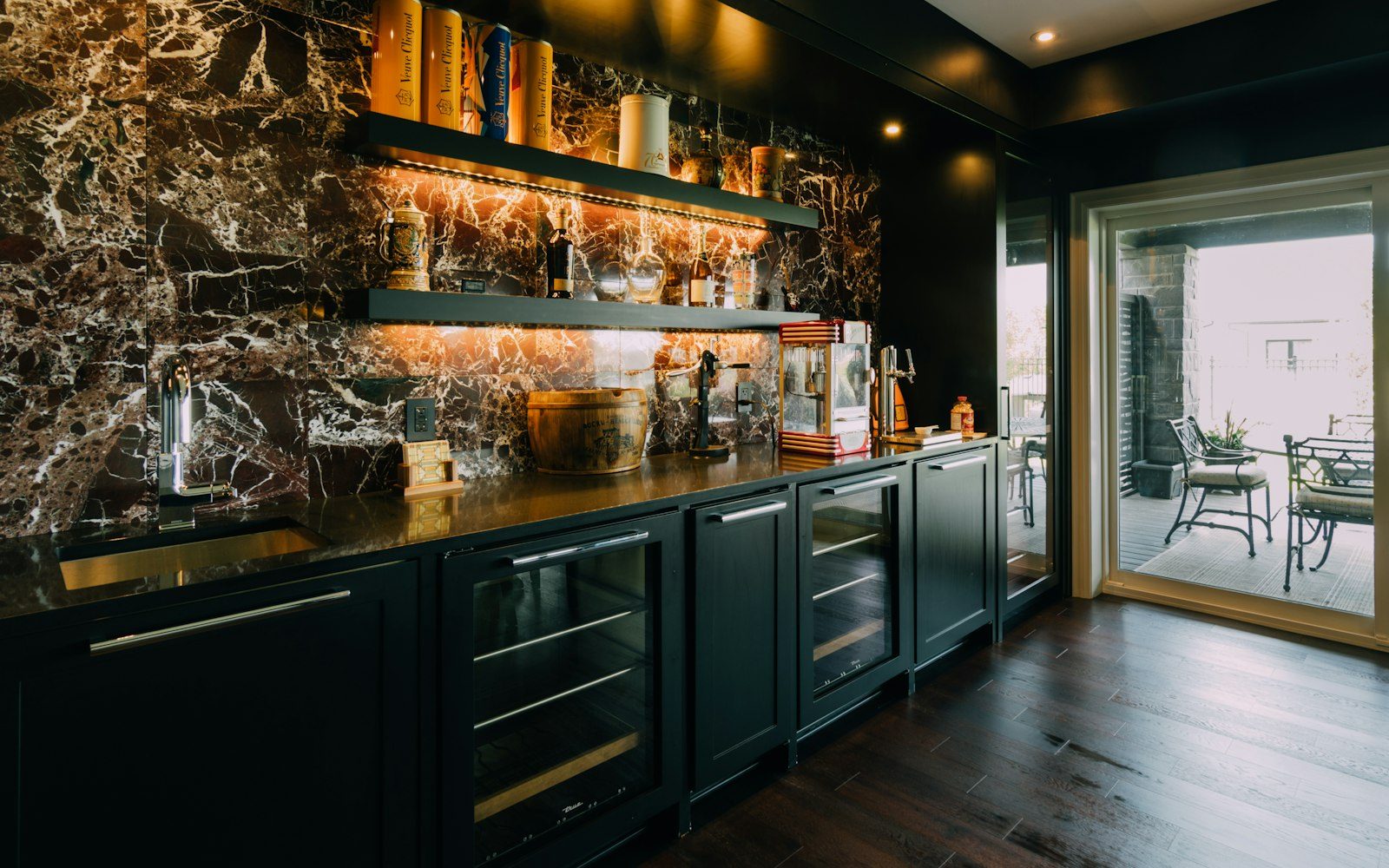 Kitchen with a marble wall and wooden floors in a private home